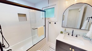 Shower, hair dryer, towels, soap