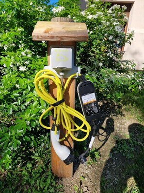 Electric vehicle charging station available for guests.