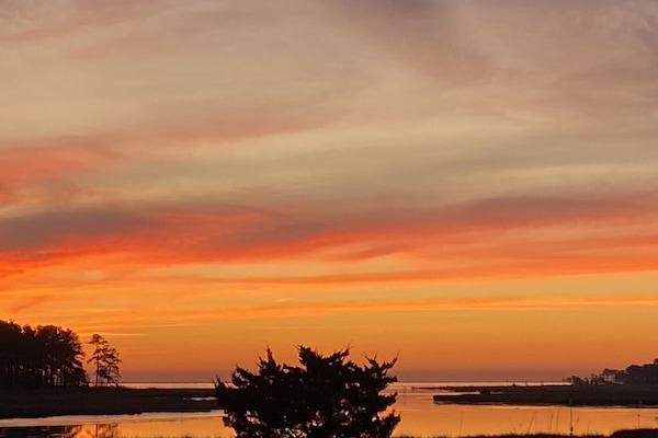 Sunset over Love Creek. Stunning view from every room!