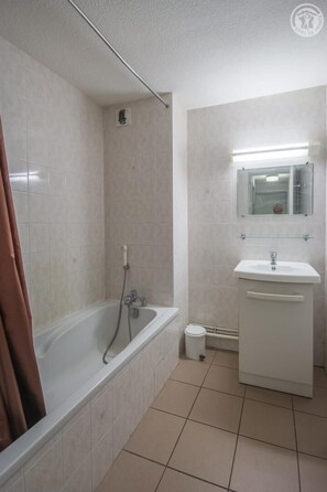 Bañera, secador de pelo