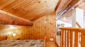 A wooden cabin room with a bed, a desk, and a view of the outside. - Symphorose - Larch (VAL-CENIS)