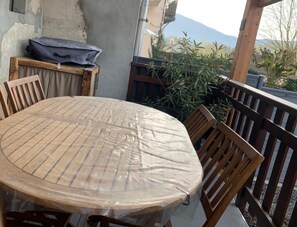 Enjoy a meal or a moment of peace on this outdoor balcony with a mountain view.