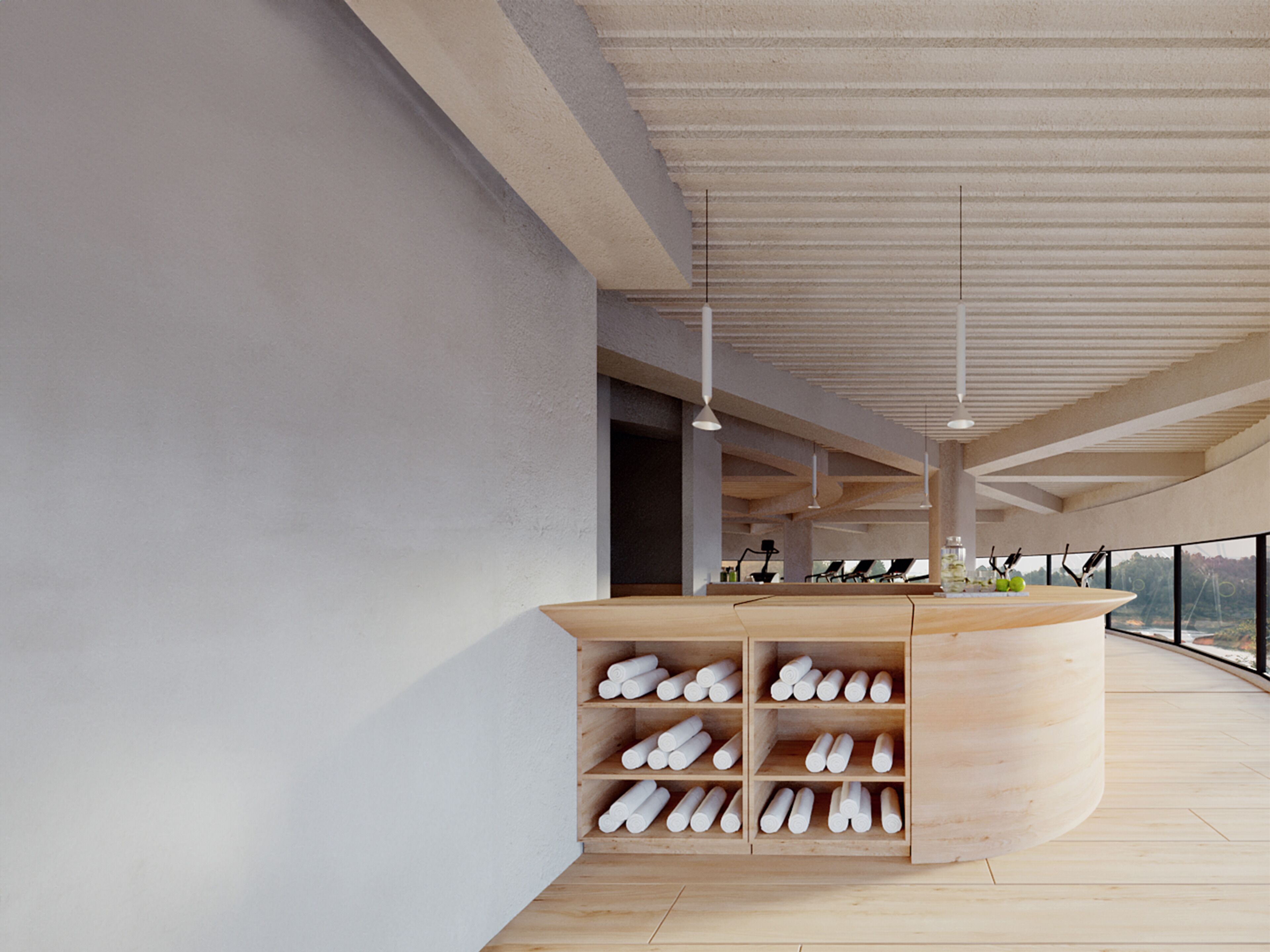 A modern interior with a curved wooden counter and shelves filled with white cylindrical objects.