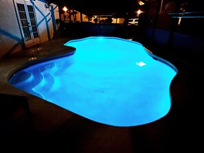A swimming pool with a blue light.