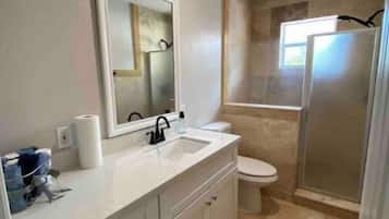 Shower, hair dryer, towels, soap
