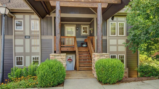 A two-story building with a wooden staircase leading to a porch. - Peace at Echota - Direct Grandfather Mtn Views! (Banner Elk)