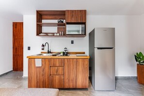 Fridge, microwave, stovetop, coffee/tea maker