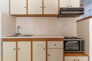 Fridge, stovetop, cookware/dishes/utensils