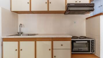 Fridge, stovetop, cookware/dishes/utensils