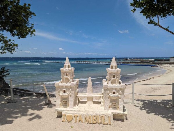 On the beach, sun loungers, beach towels
