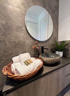 Shower, hair dryer, towels, soap