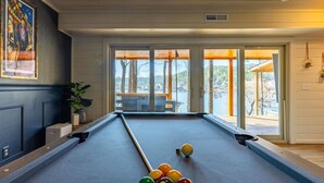 A pool table with balls, a potted plant, and a painting on the wall. - Lake Front Home w/Private Dock, Kayaks, Fire Pit & Hot Tub | Community Pool & Tennis (Waleska)