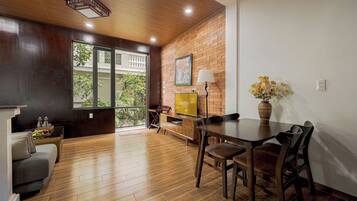 Deluxe Apartment, 2 Bedrooms | Living area | 42-inch Smart TV with cable channels