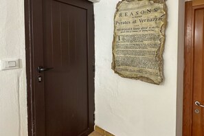 A door with a wall-mounted sign containing text.