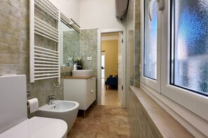 Shower, eco-friendly toiletries, hair dryer, bidet