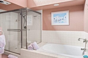 Bathtub, hair dryer, towels, shampoo
