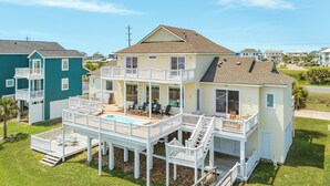 A two-story house with a deck, a pool, and a small porch. - Beachfront w/POOL ON DECK, Private Dune Walkover, 5 Bedrooms (Galveston)