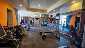 A gym with treadmills, spinning bikes, and weightlifting equipment. - Luxury 3-Bedroom Apartment at Eko Pearl, Eko Atlantic, Victoria Island, Lagos. (Lagos)