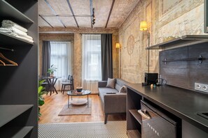 Design Apartment | Living area | 40-inch Smart TV with digital channels