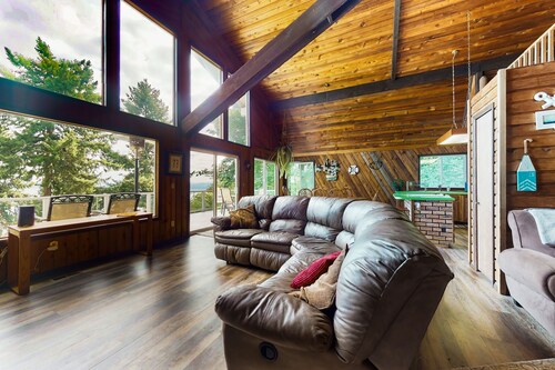 Sound view home full of vintage charm with game room, wood stove, & gas grill