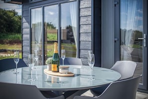 Enjoy a romantic dinner for two in our serene garden setting, surrounded by lush greenery and a beautiful view.