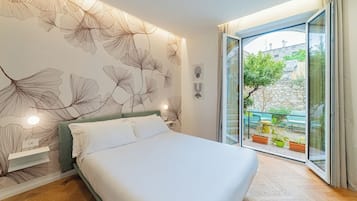 Habitación clásica, vista al jardín | Ropa de cama de alta calidad, camas con efecto memoria y minibar