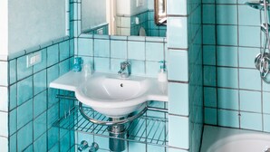 A bathroom with a white sink, a mirror, and a shower. - Resort Ravella: Lord Executive room (Sant´Agata sui Due Golfi)