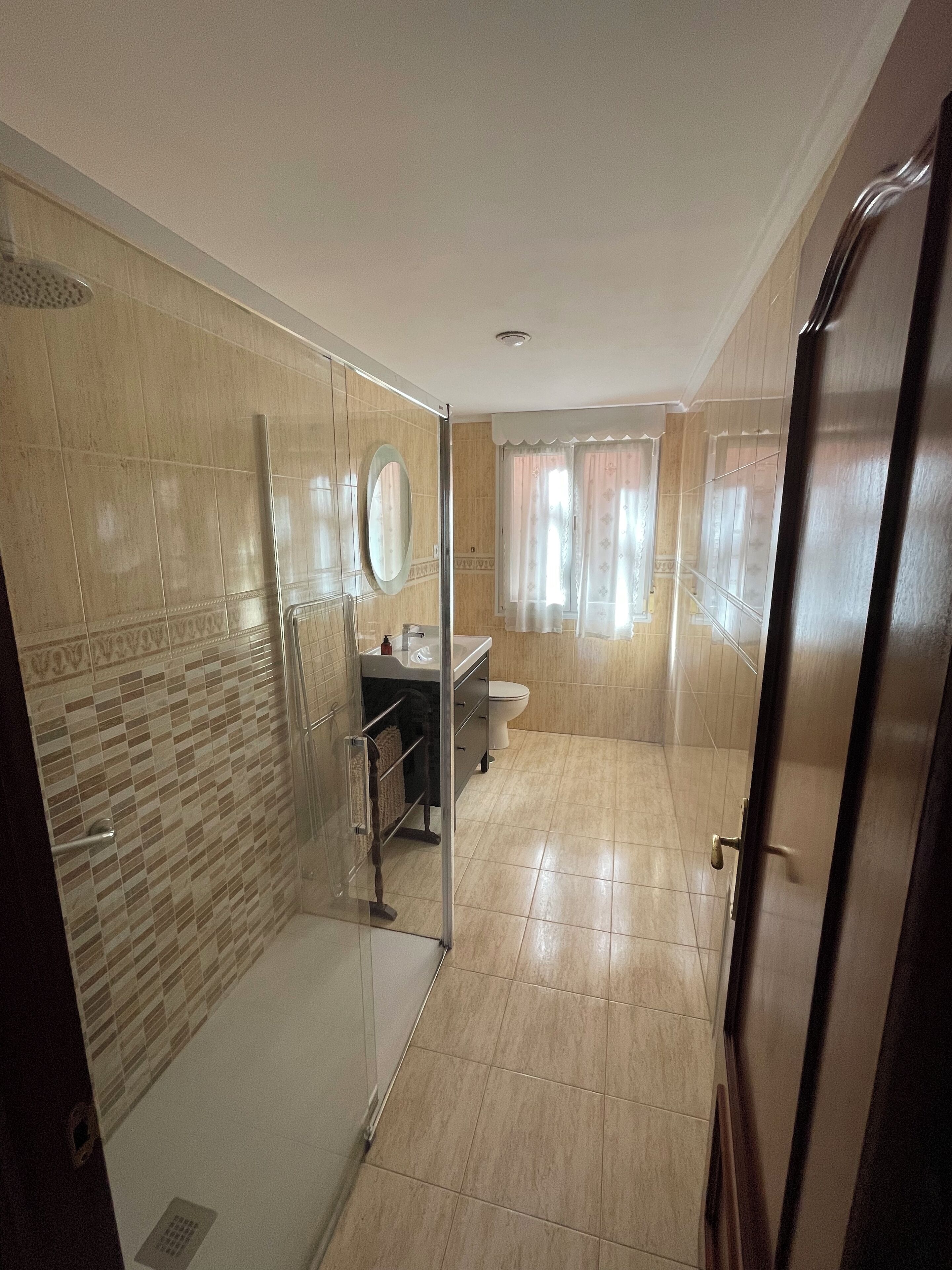 Shower, hair dryer, towels, toilet paper