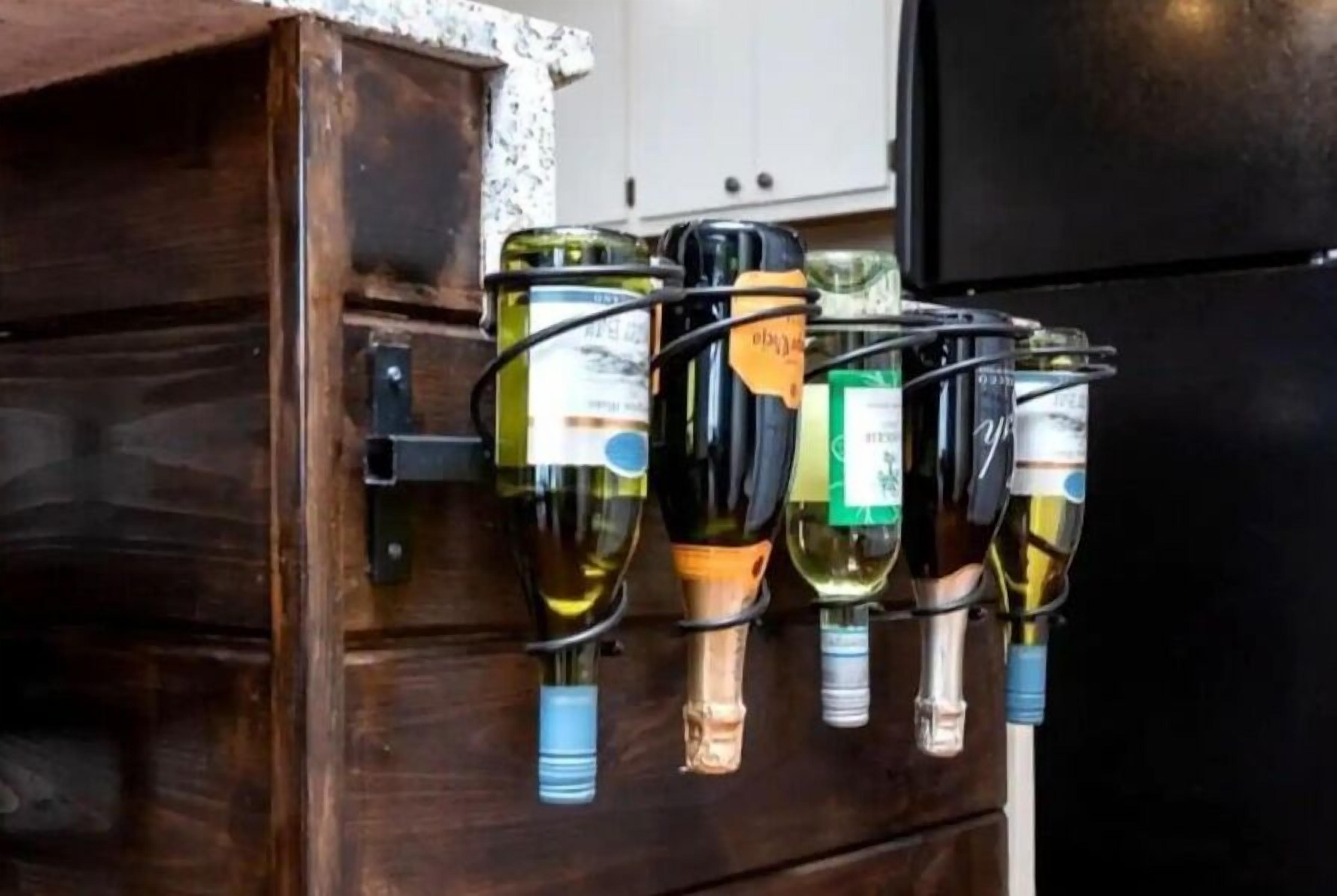 A wine rack with several bottles of wine.