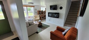 Smart TV, fireplace, foosball, books