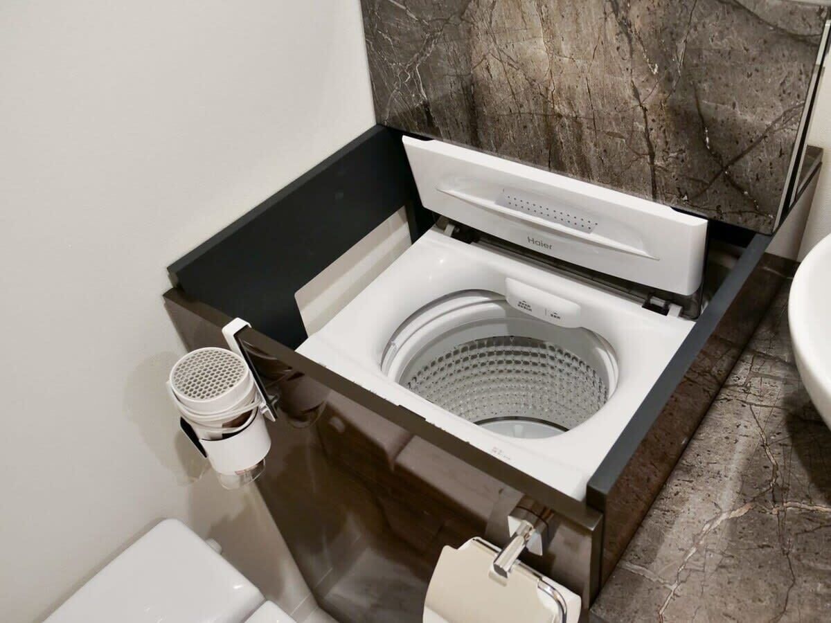 Bathtub, hair dryer, towels