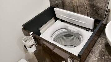 Bathtub, hair dryer, towels