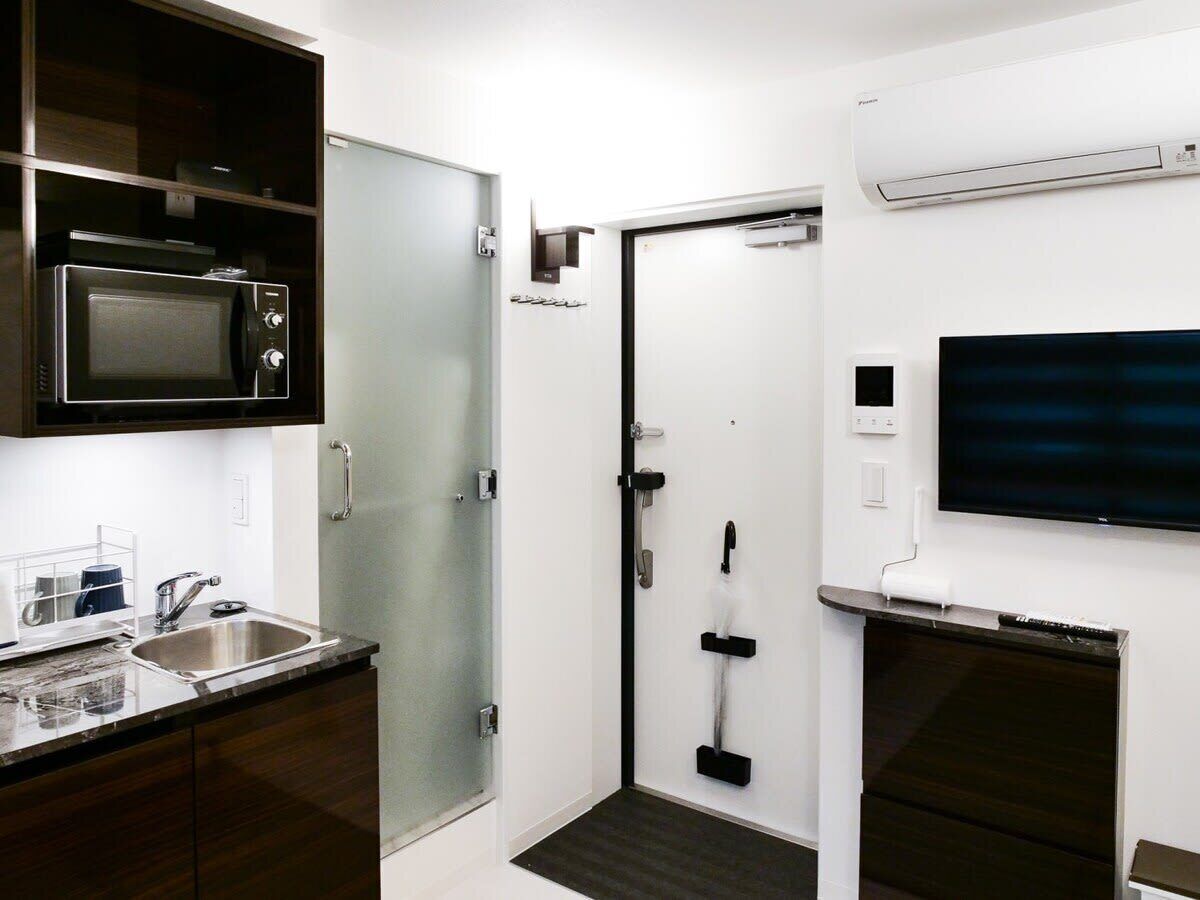 Fridge, microwave, electric kettle, cookware/dishes/utensils