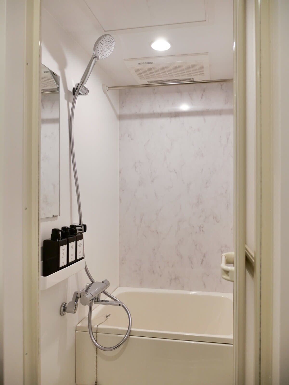 Bathtub, hair dryer, towels, soap