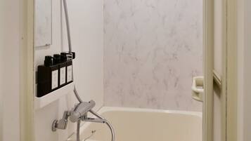 Bathtub, hair dryer, towels, soap