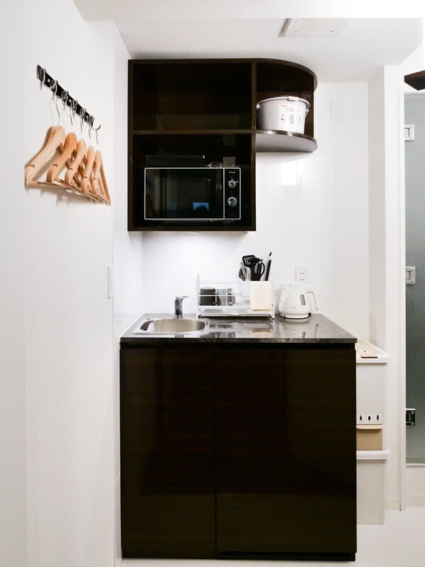 Fridge, microwave, cookware/dishes/utensils