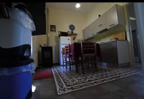 Fridge, stovetop, electric kettle, cookware/dishes/utensils