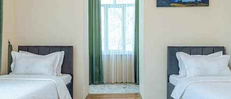 Twin Room | Blackout drapes, iron/ironing board, free WiFi