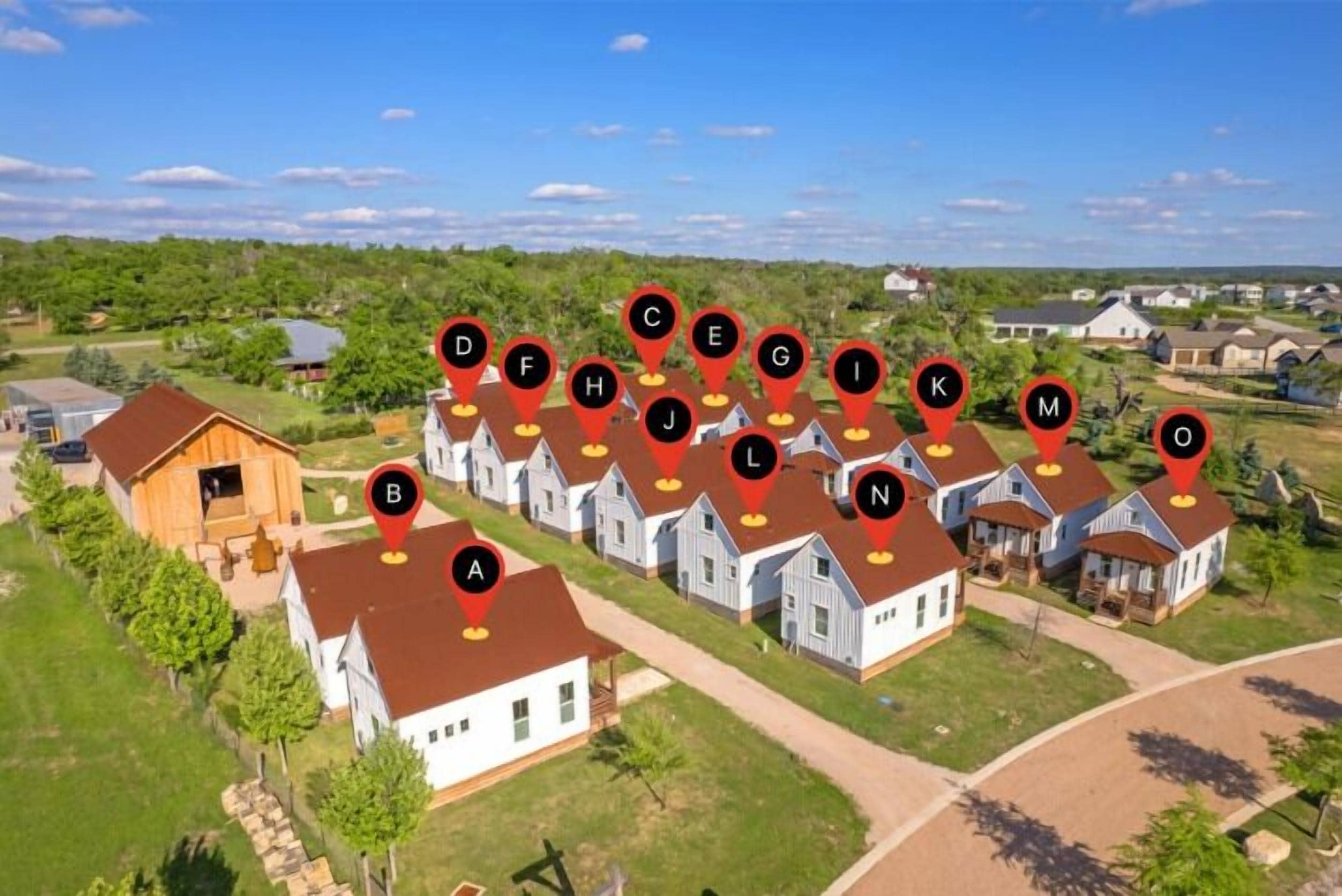 A residential area with houses marked by numbered location pins.