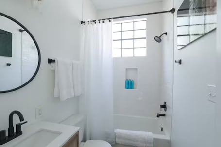 Hair dryer, towels, soap, shampoo. Spanish Town Revival Upscale Downtown Retreat