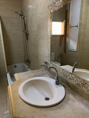 Basic Double Room, Smoking, City View | Bathroom | Bathtub, deep soaking tub, bathrobes, slippers - Egypt (Giza)