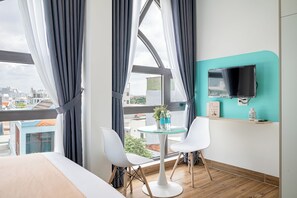 Deluxe Suite | Living area | LCD TV - Cozrum Homes - Cozytel Residence (Ho Chi Minh City)