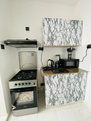 Private kitchen - COZY OMUTS ONE BEDROOM WITH SWIMMING POOL (Kiambu County)