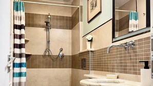 A bathroom with two toilets, a shower, a sink, and a mirror. - APARTMENT 'ORCHID' WHIT ONE BEDROOM.  (Firenze)