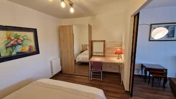 1 bedroom, desk, iron/ironing board, travel crib