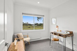 Enjoy a peaceful view of the surrounding countryside from this room's large window.