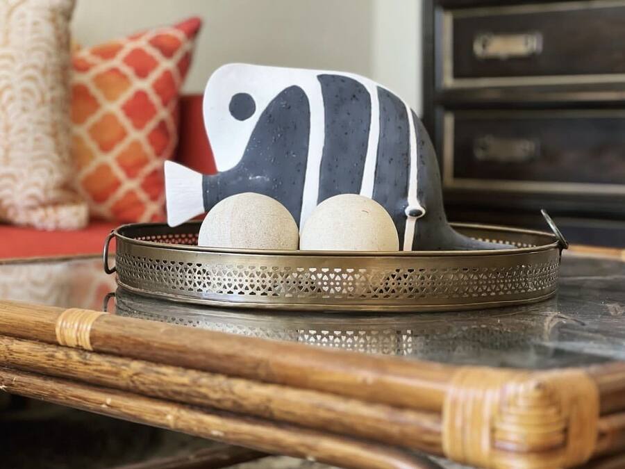 A tray with decorative items on a table.