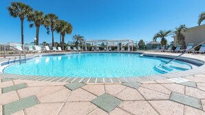 A swimming pool with lounge chairs and a pergola, surrounded by palm trees. - Private Beach Access! Complementary Beach Service! (Miramar Beach)