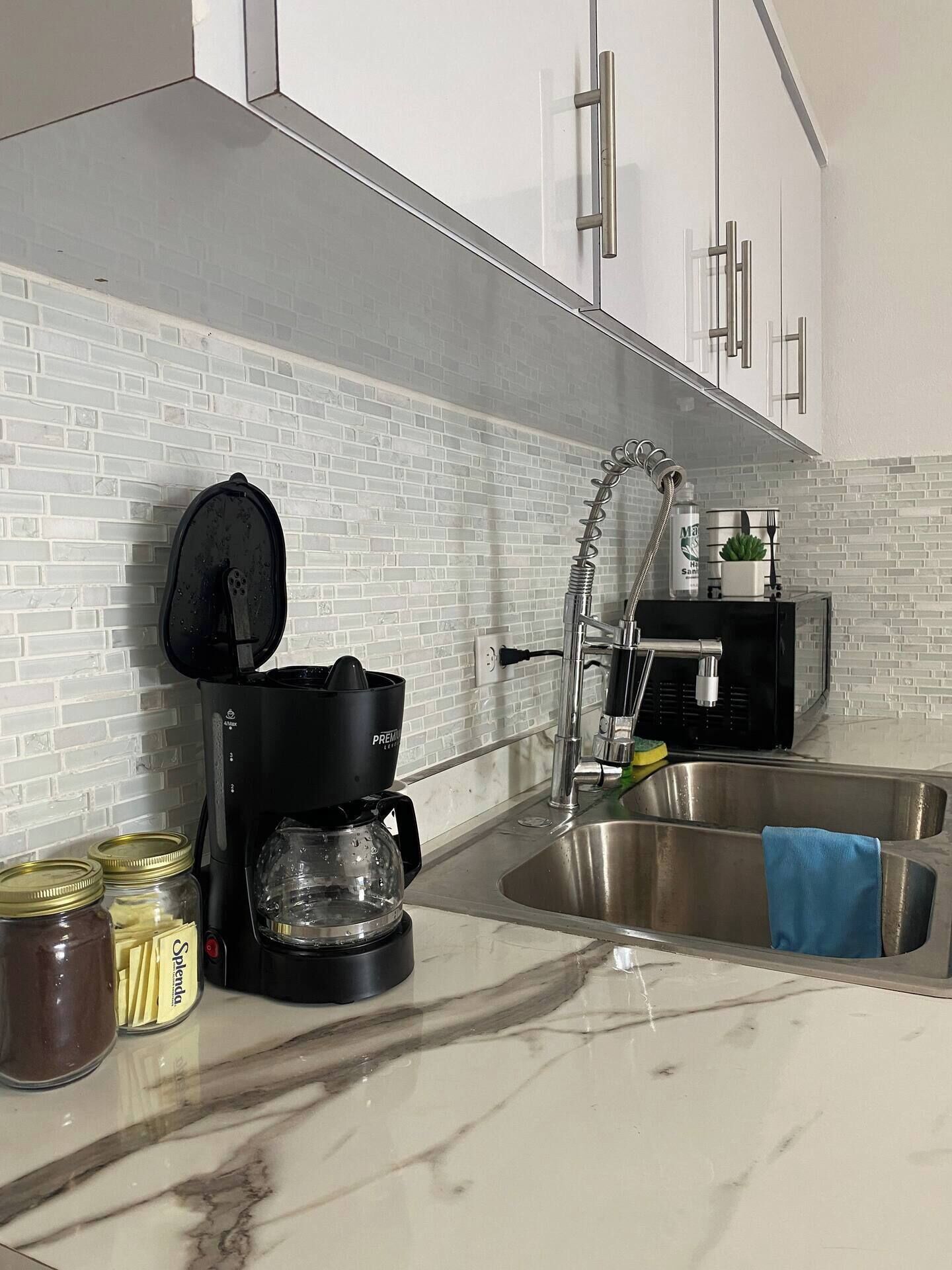 Microwave, coffee/tea maker, toaster, cookware/dishes/utensils