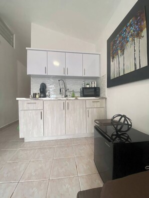 Microwave, coffee/tea maker, toaster, cookware/dishes/utensils